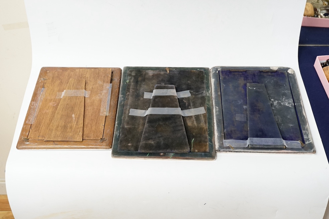 Three assorted early 20th century silver mounted photograph frames, including Birmingham, 1916, (some marks rubbed), largest 27cm. Condition - poor to fair